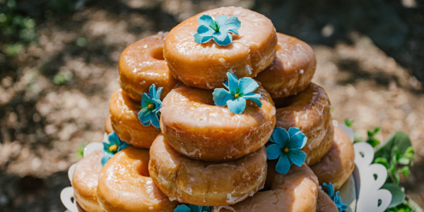 plate of stacked glazed donuts
