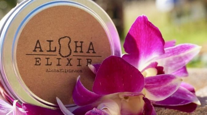 Aloha Elixir tin travel candle in purple flowers