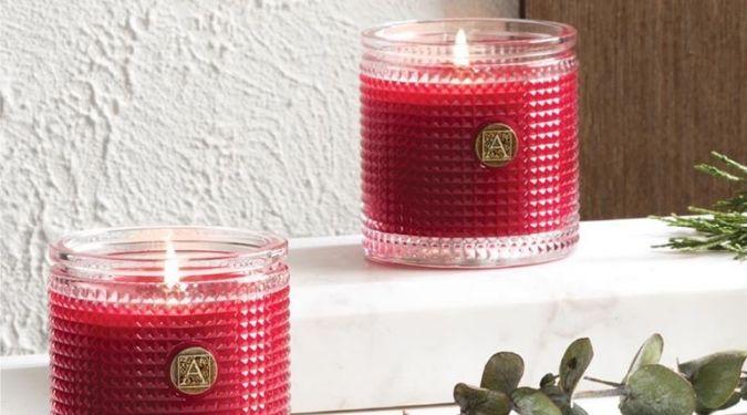 Aromatique luxury candle red wax textured glass on ledge