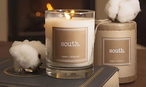 South candle displayed with cotton accents and Southern-inspired home fragrance décor