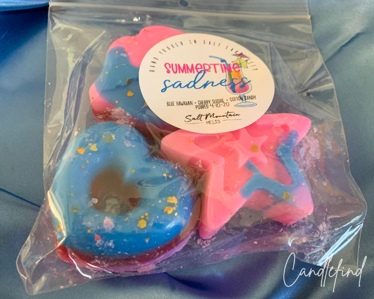 Salt Mountain Melts Summertime Sadness wax melts featuring colorful donut and starfish-shaped wax melts in a clear package.