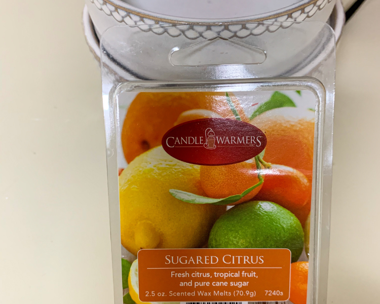 Candle Warmers Sugared Citrus wax melts in front of a wax warmer dish