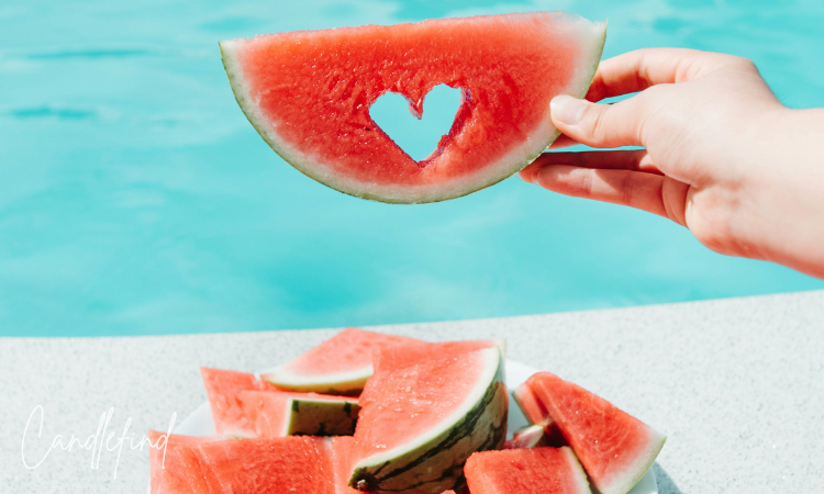 Fresh watermelon slices beside a swimming pool on a summer day